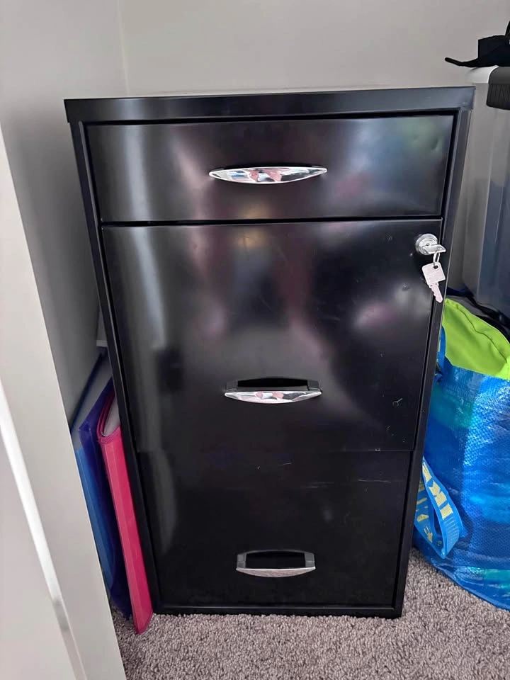Black filing cabinet with keys