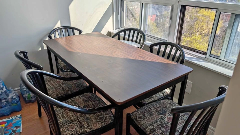 Dark wood dining table and 6 chairs