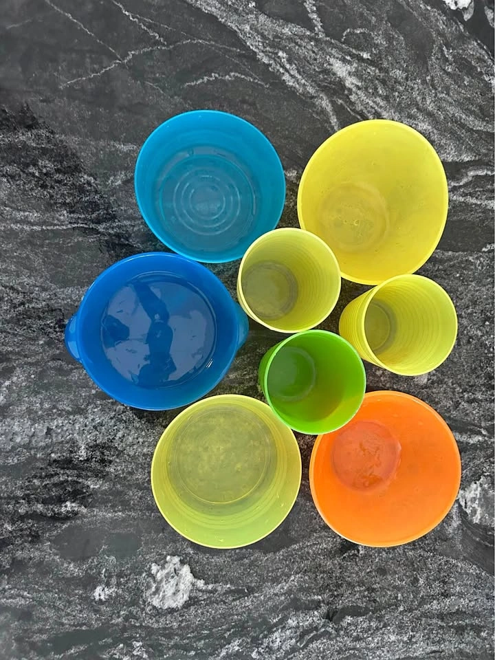 Colorful plastic bowls and cups set