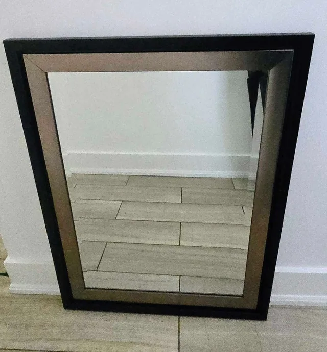 Mirror with black and gold/brass frame