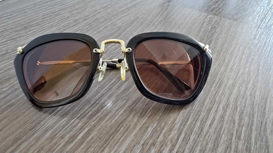 Miu Miu Black and Gold Sunglasses