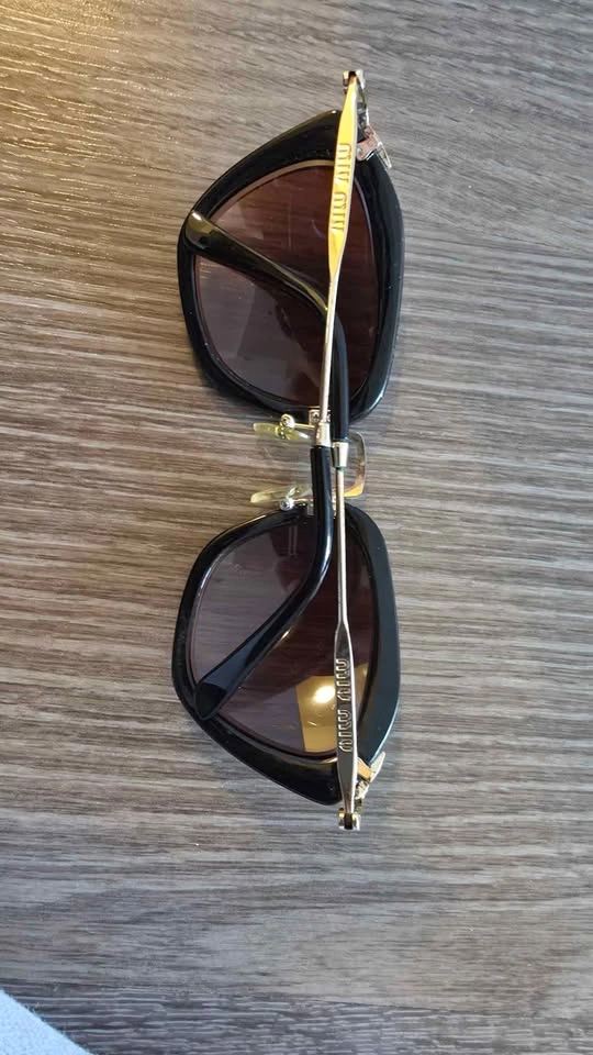 Miu Miu Black and Gold Sunglasses - photo 2