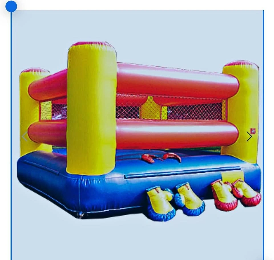 Inflatable boxing ring with oversized boxing gloves