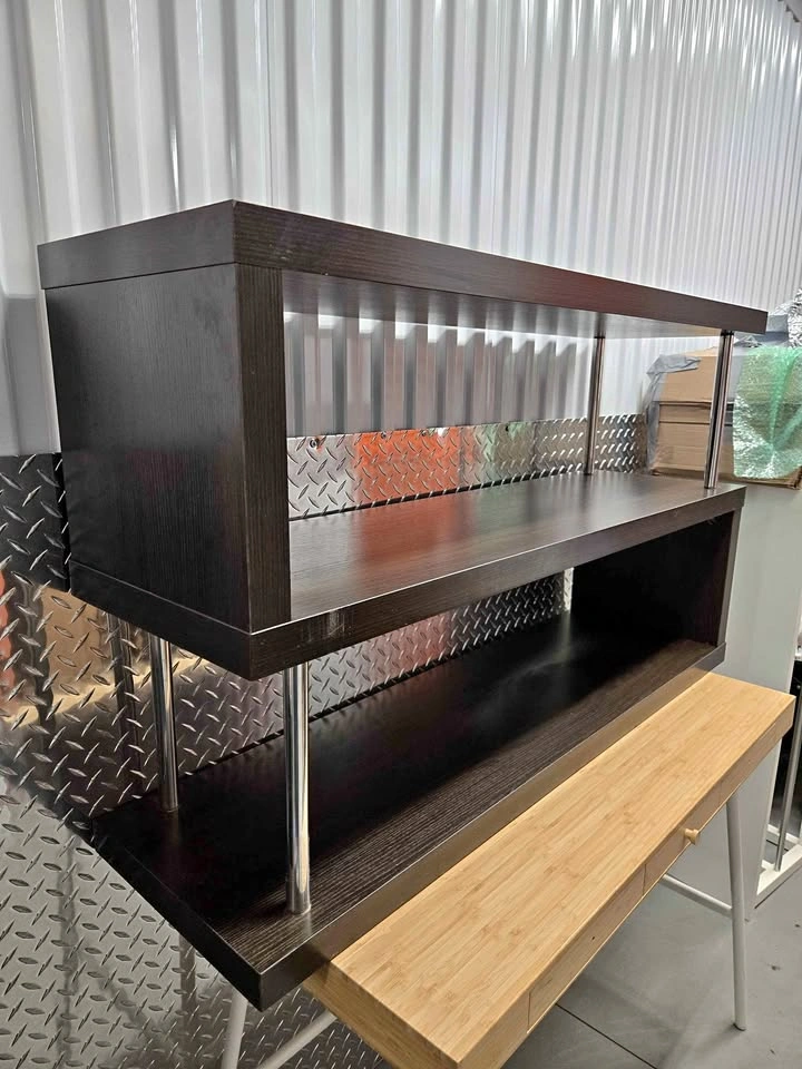 Dark brown shelving unit with metal poles