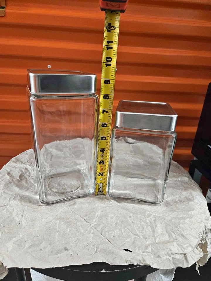 2 Glass Jars w/ Silver Lids - 10.5" & 7" Tall