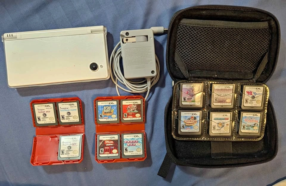 DSi w/ Protective Case, Carry Case, Charger, + 13 Games