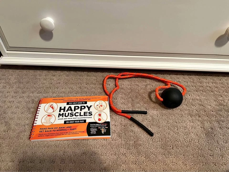 Tiger Tail Massage Ball on Rope and Book