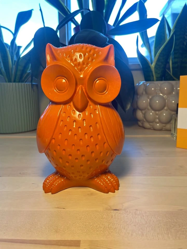 Orange owl figurine