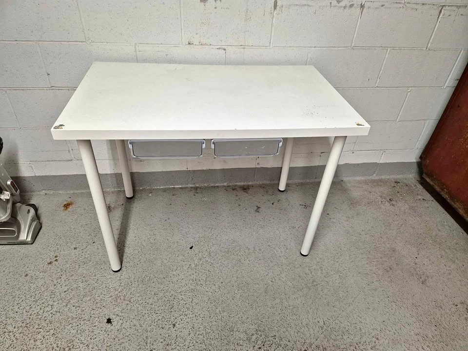 white IKEA LINNMON desk with four legs
