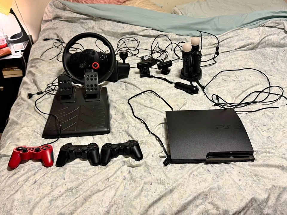 PS3 SLIM 160 GB with Logitech Wheel & 13 Games