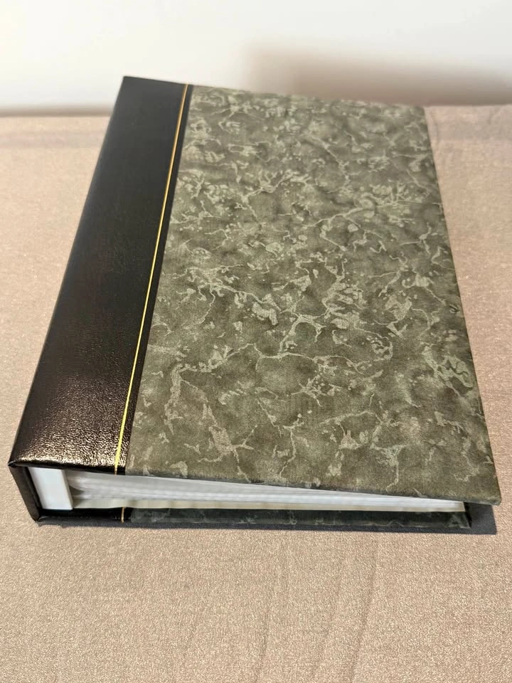 7 1/2 x 10" Photo album (200 photos) from Blacks