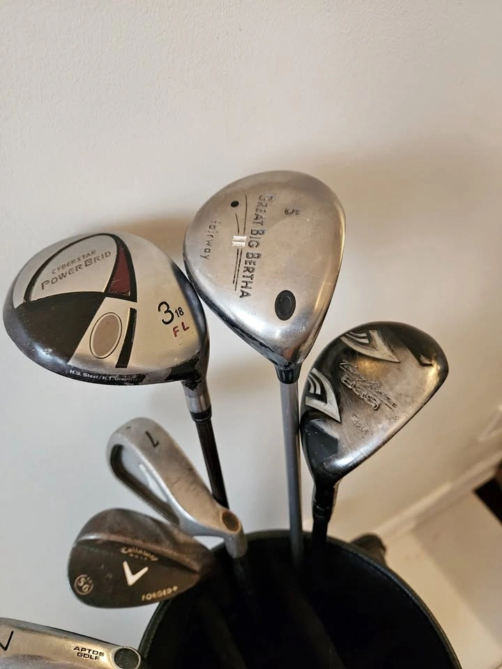Bunch of clubs and golf cart bag for sale.