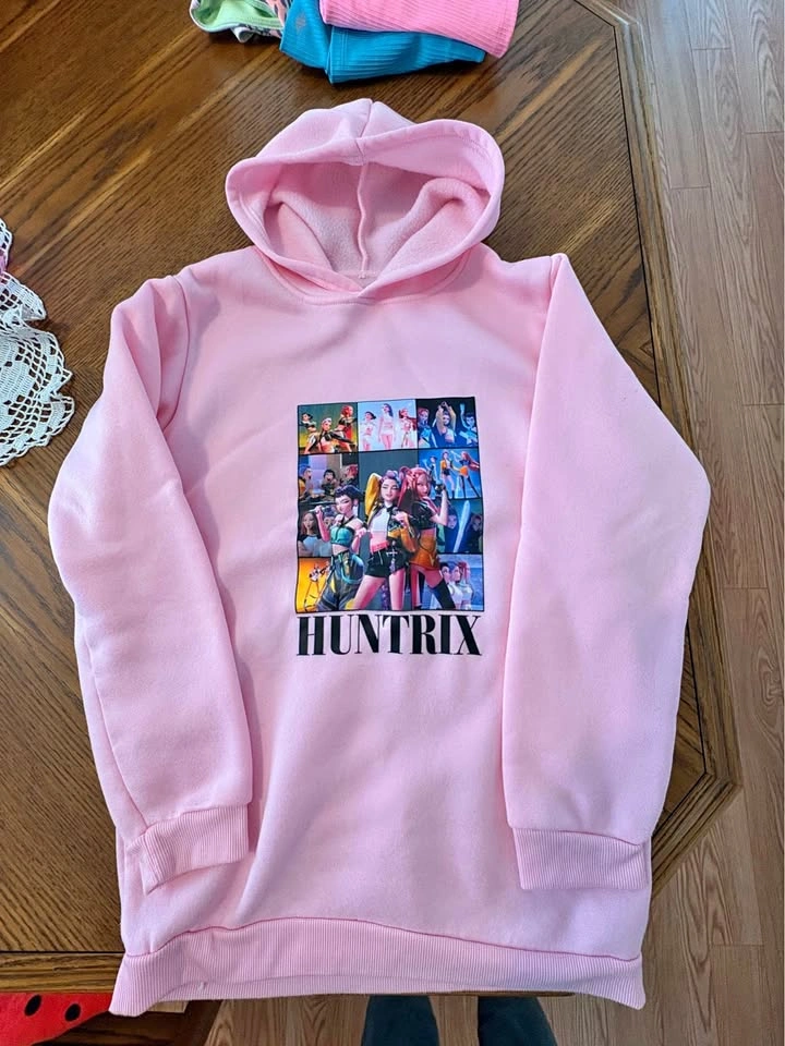 Girls light pink Huntrix Hoodie (size large)