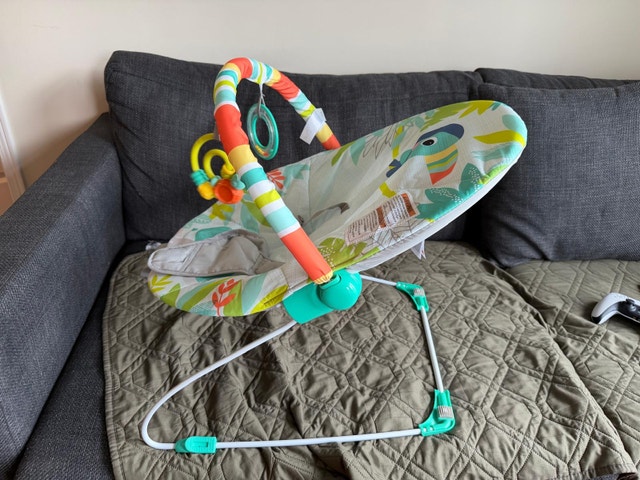 Rainforest vibes, colourful tropical print baby bouncer