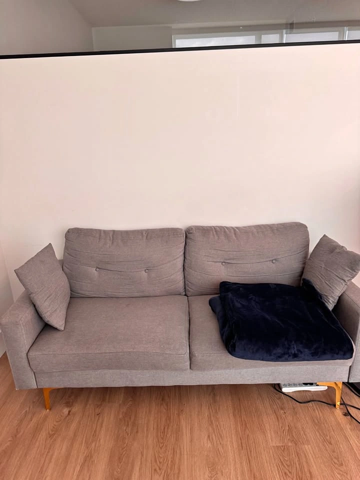 Grey two seater couch for sale.