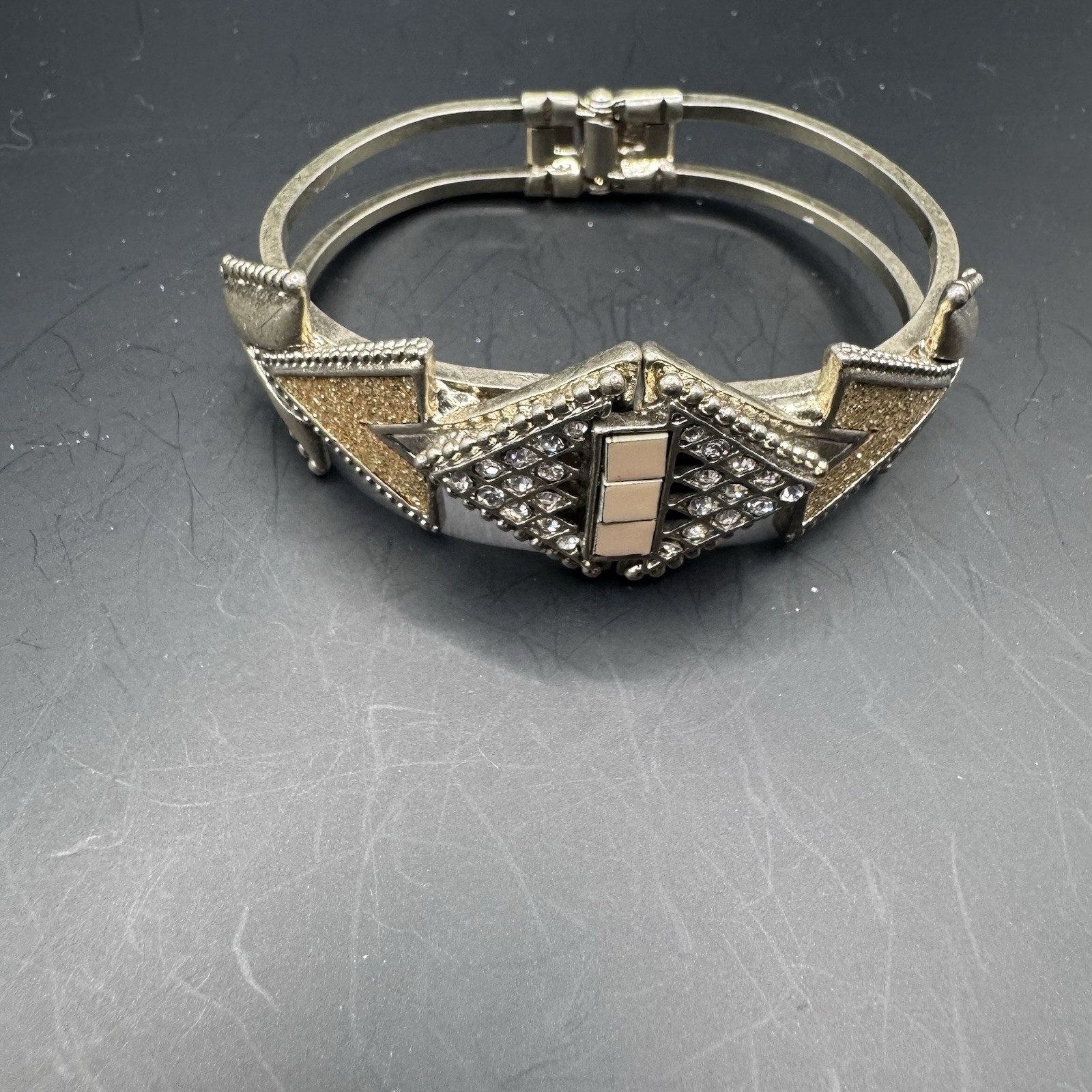 Large hinge clasp Deco- Inspired bracelet with gold tone and rhi