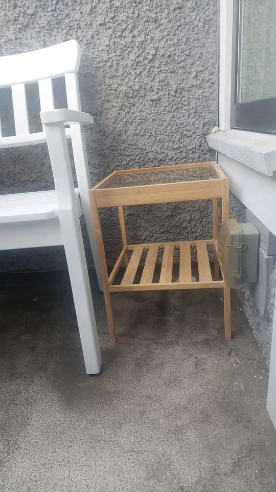 White patio chair and wood side table - photo 2
