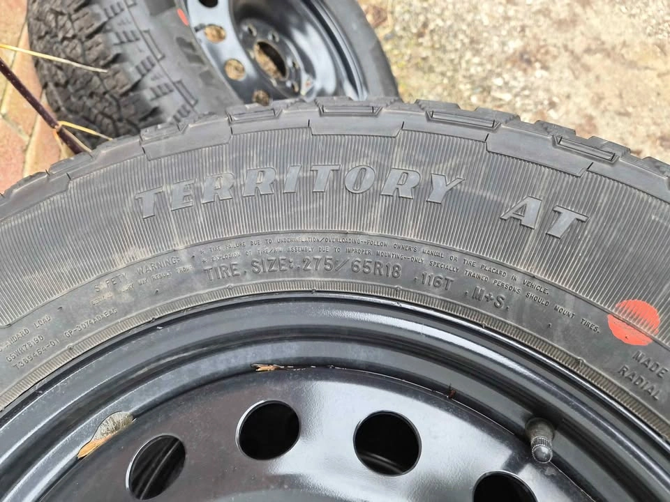 Goodyear Territory AT Tire on Black Steel Rim - 235/65R18 - photo 5