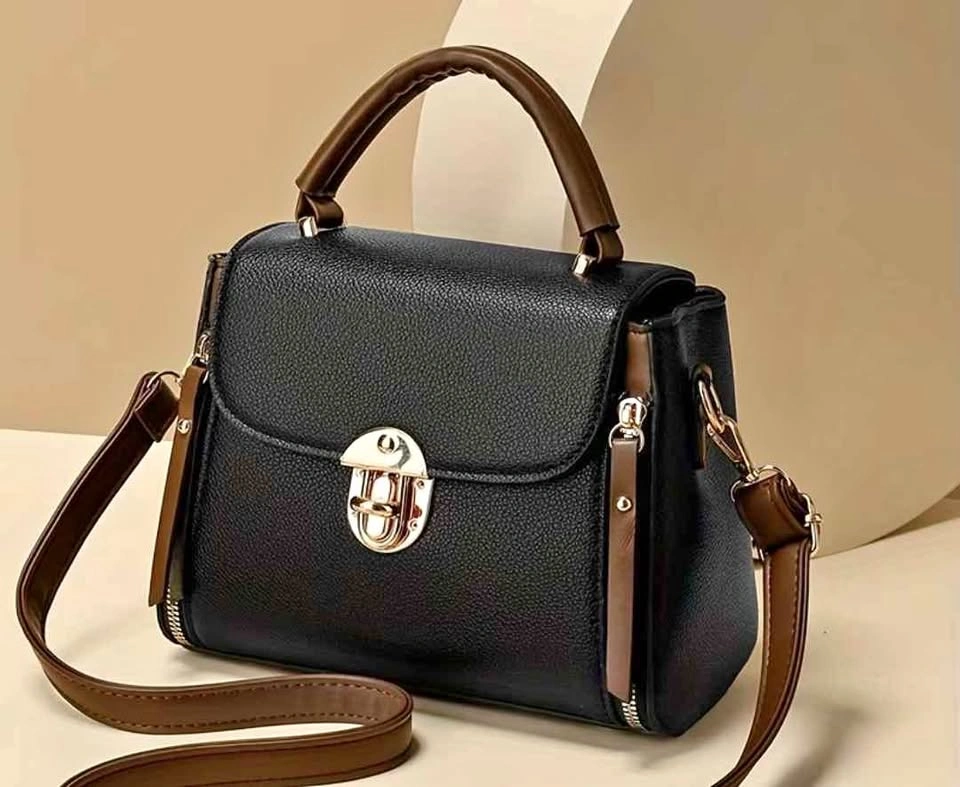 Brand new fashionable black color small handbag for women ( firm