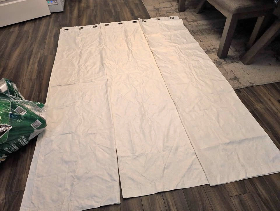 Pair of Cream Grommet Curtains