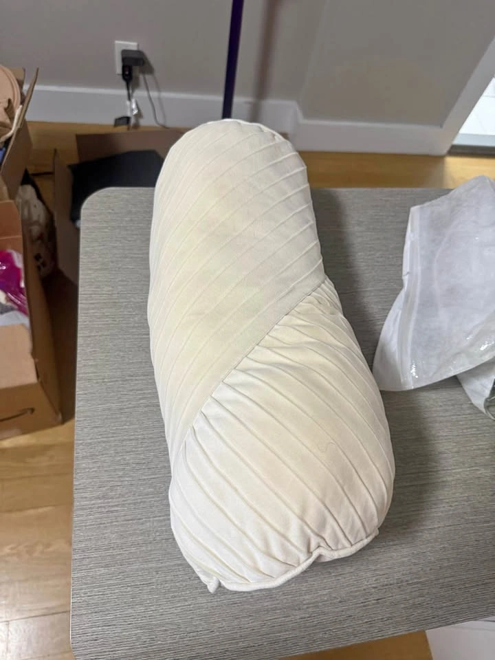 Cream pleated bolster pillow
