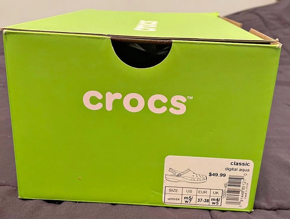 Brand new, never worn, Digital Aqua colored Crocs, size men’s 5/