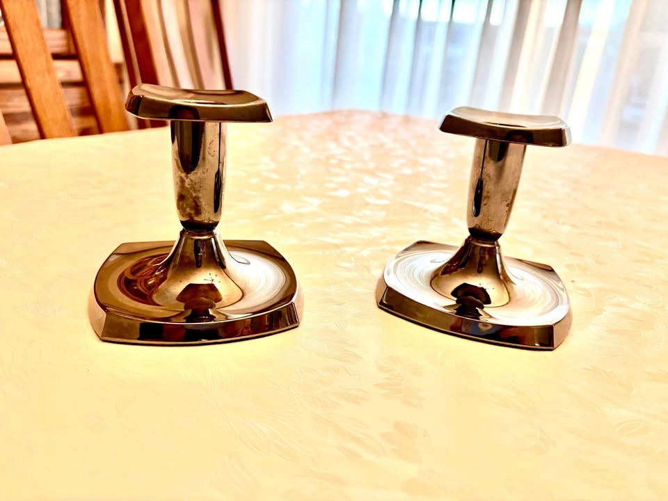 Pair of sleek silver tone candle holders