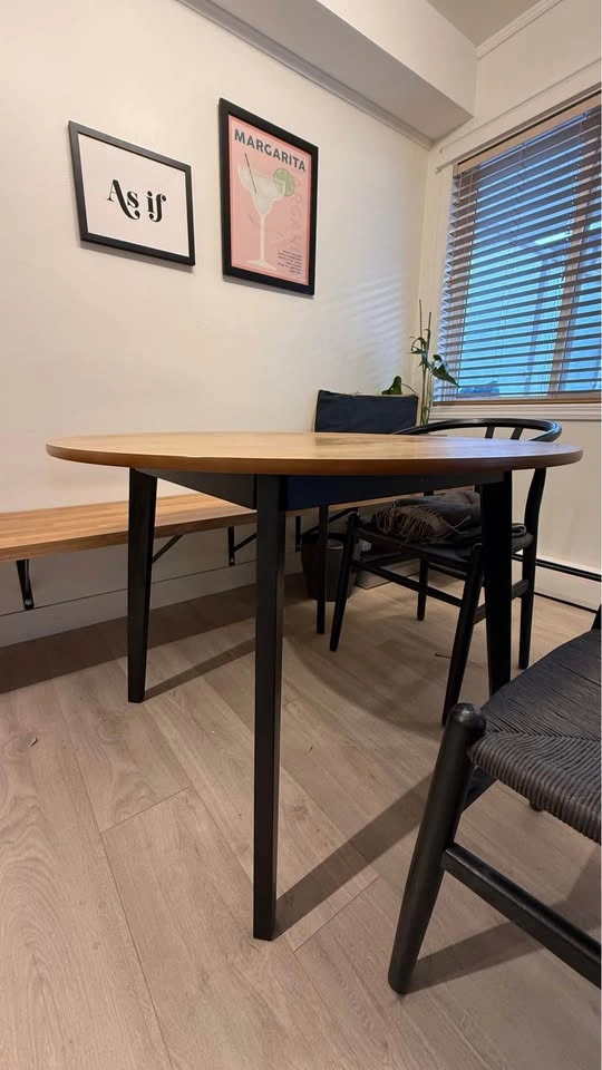 Round wood dining table with black legs - photo 2