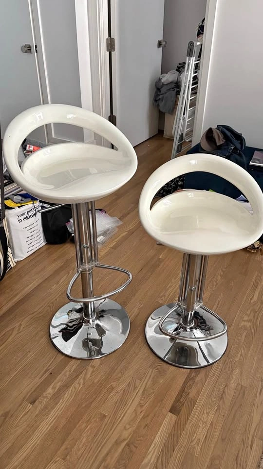 Pair of adjustable height swivel stools