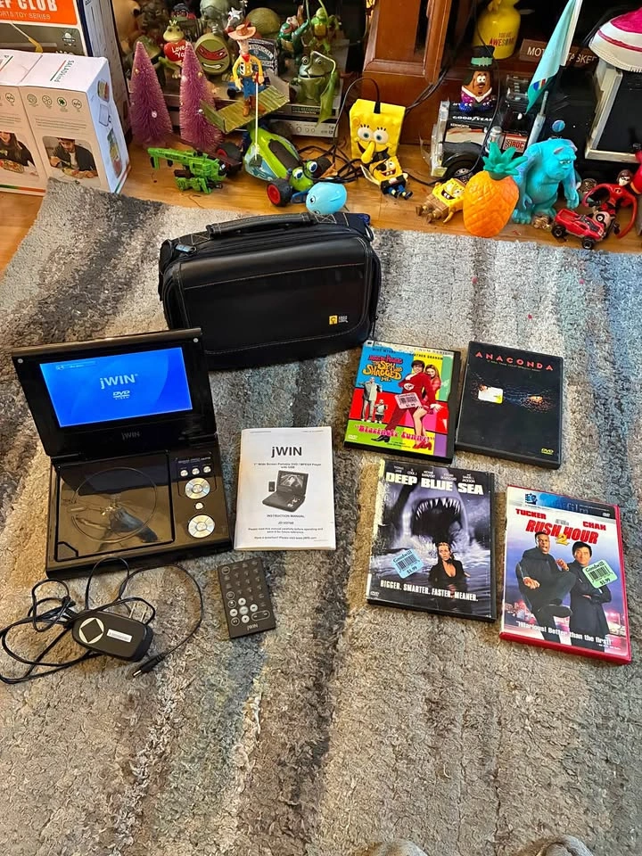 7” Wide Screen Portable DVD Player with Case and 4 DVDs