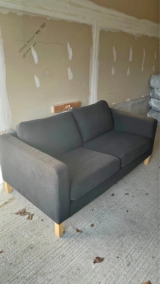 Dark Grey 2-Seater Sofa – Comfortable, but sun-faded – Great Opp