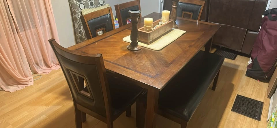 Dining table with four chairs and a bench. - photo 2