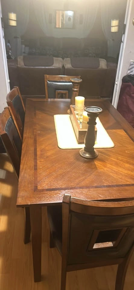 Dining table with four chairs and a bench. - photo 3