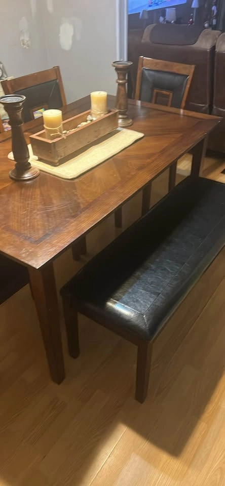 Dining table with four chairs and a bench. - photo 4