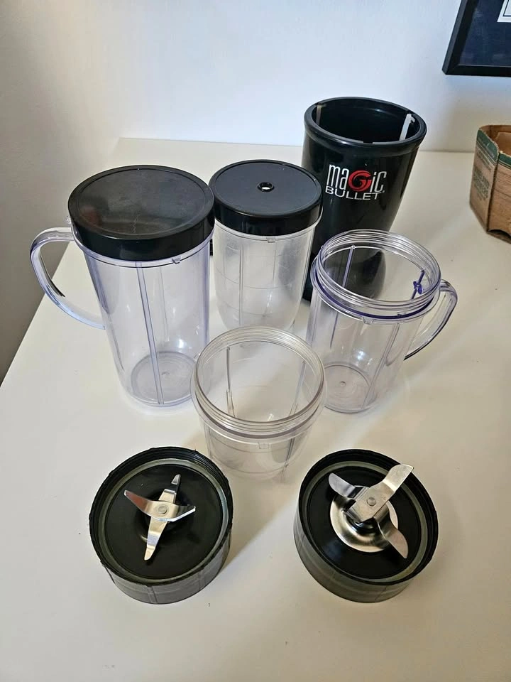 Magic Bullet with multiple blades, cups and lids