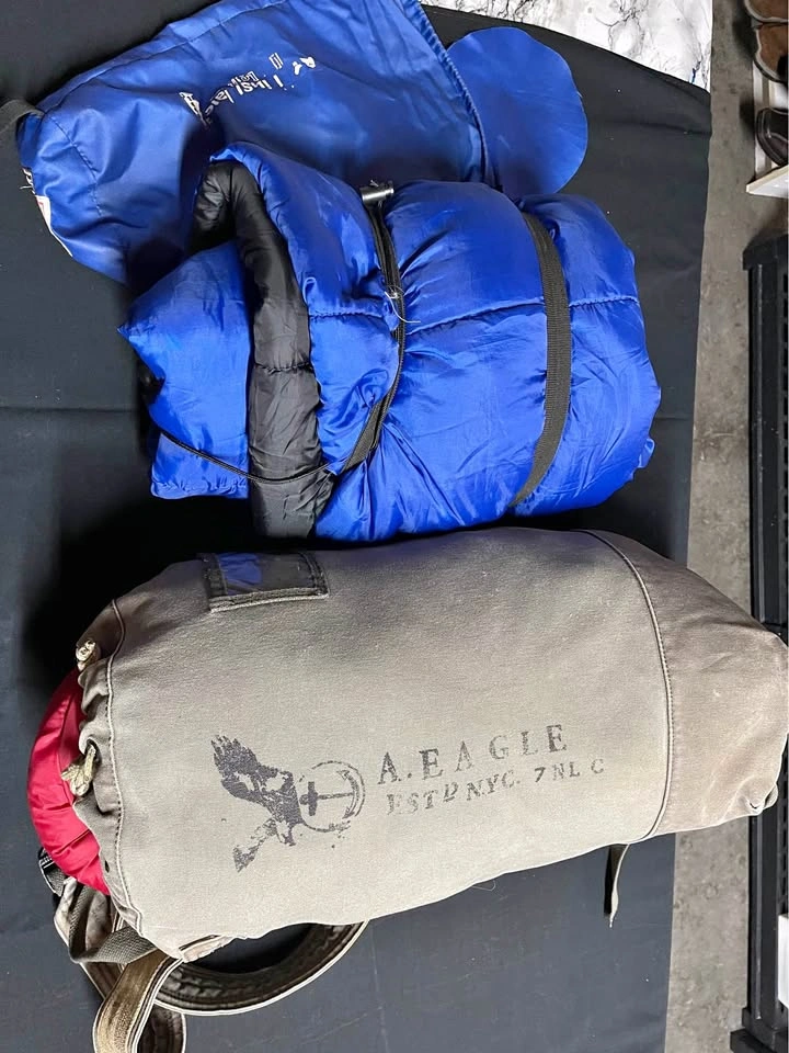 2 Sleeping Bags and American Eagle Duffel Bag