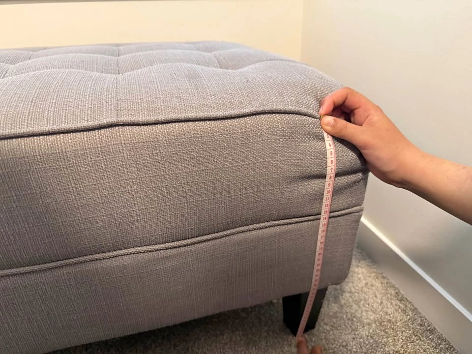 Gray tufted bench
