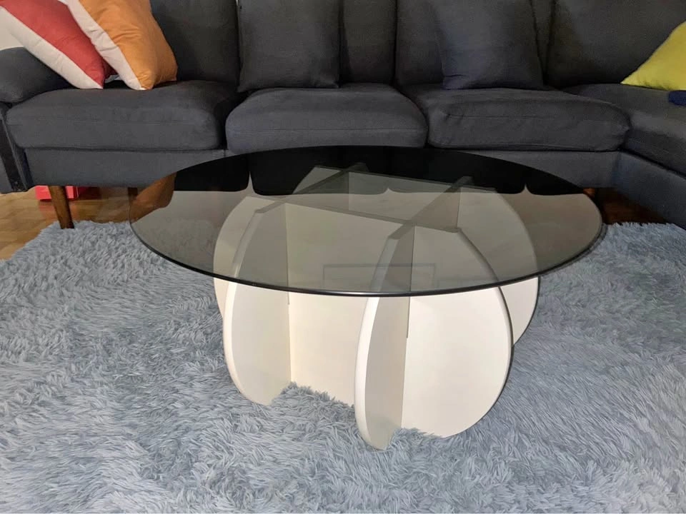 Glass coffee table with wooden legs