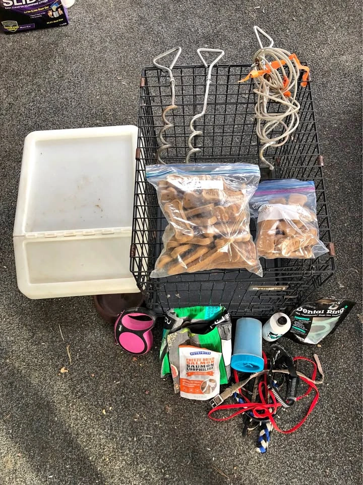 Dog cage, food container, and supplies
