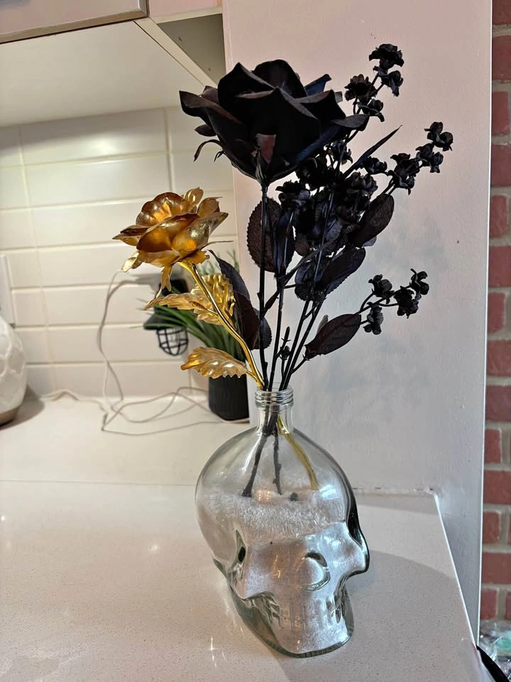 Skull Vase with Faux Flowers