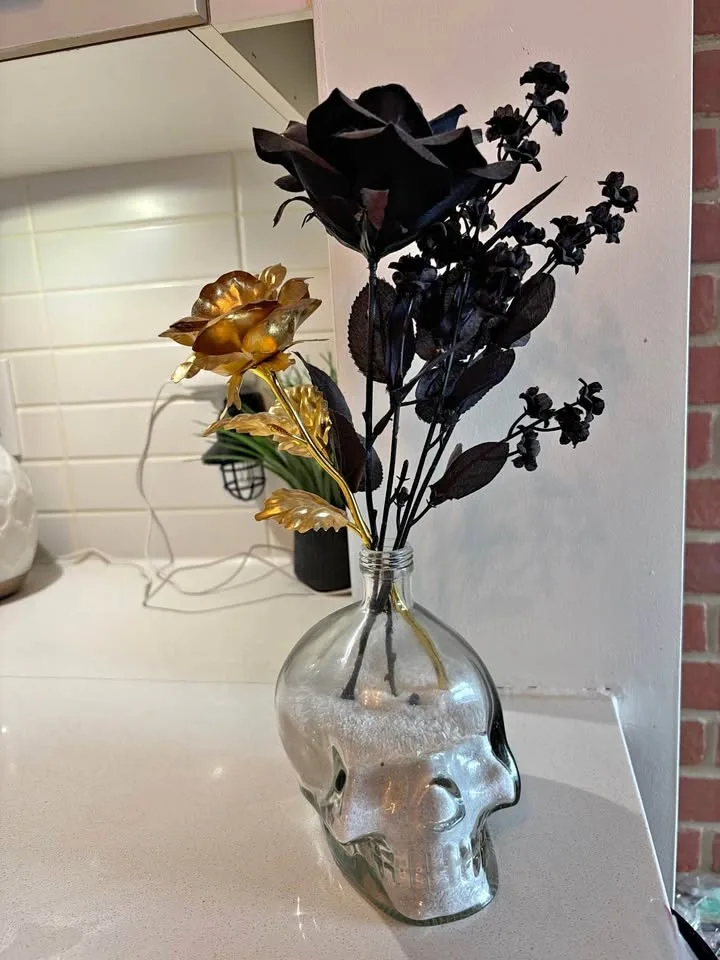 Skull Vase with Faux Flowers