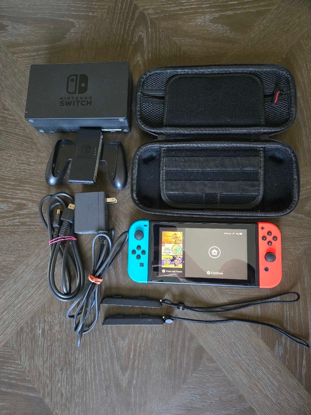 Nintendo Switch Console with Hori Split Pad and 2 Cases