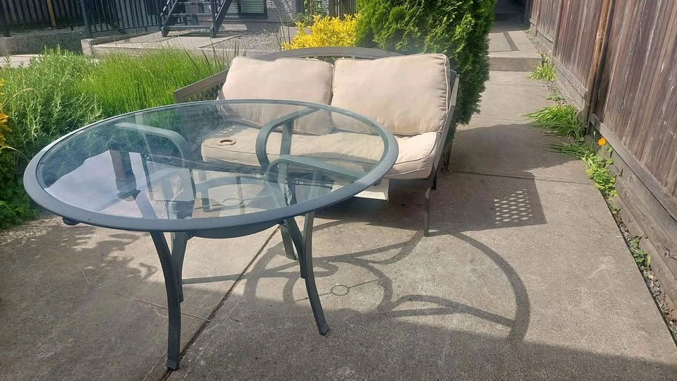 Outdoor Metal Loveseat with Tan Cushions