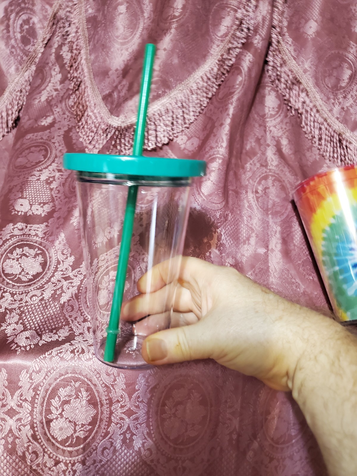 Clear Plastic Tumbler with Green Lid and Straw