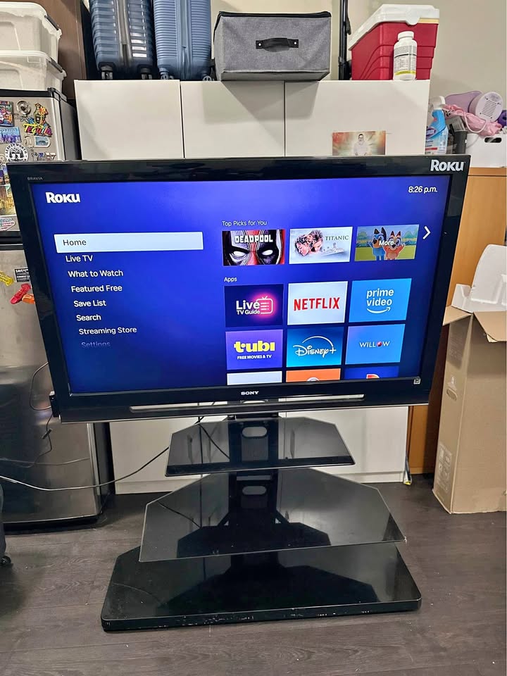 Sony Bravia 52” TV with Stand and Roku TV Device