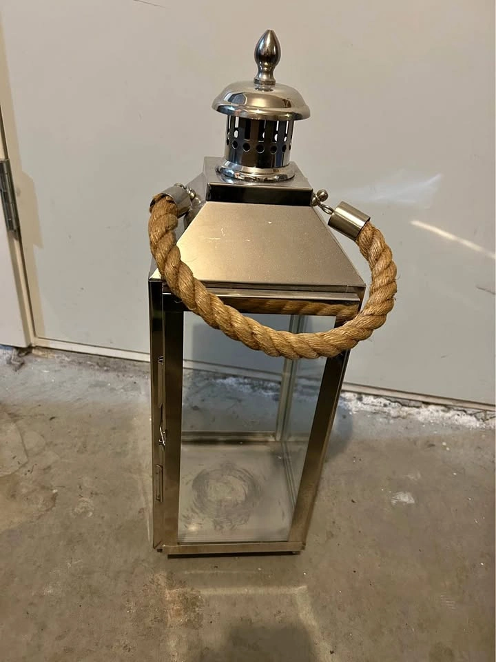 Silver metal lantern with rope handle