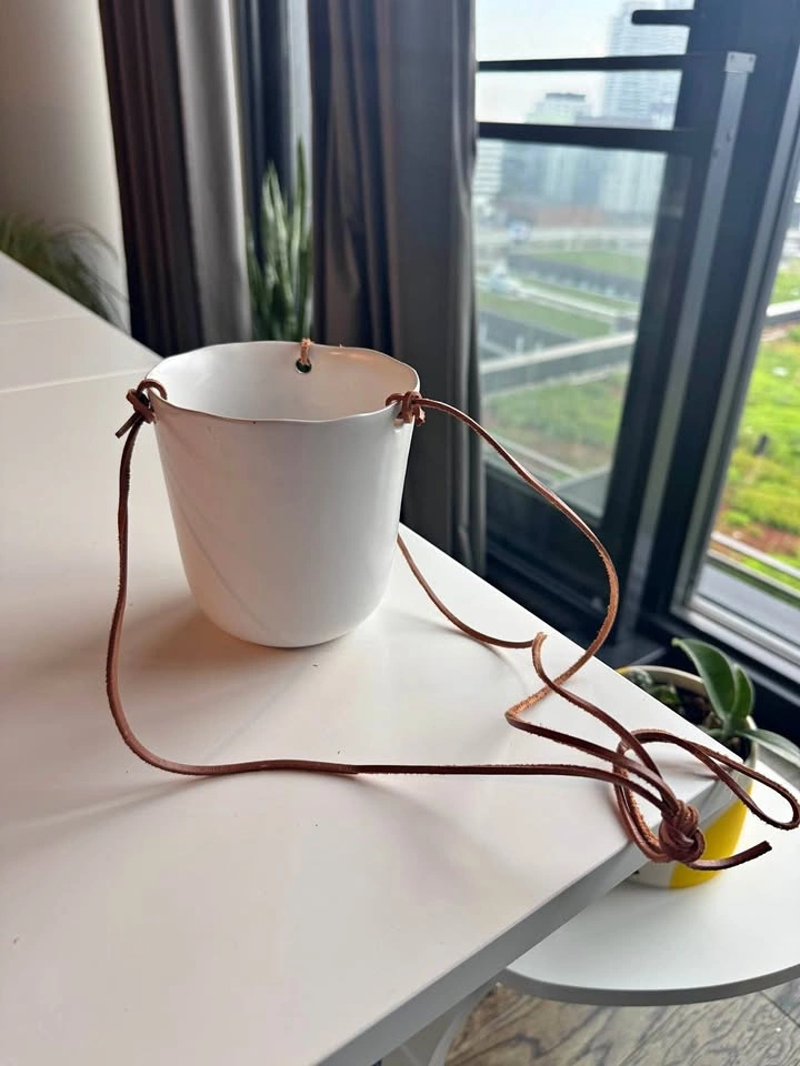 Hanging pot with leather straps