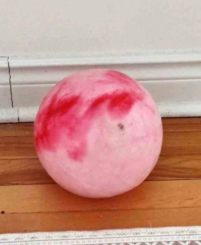 Colorful ball. Pink and red marbled pattern. Good for play.