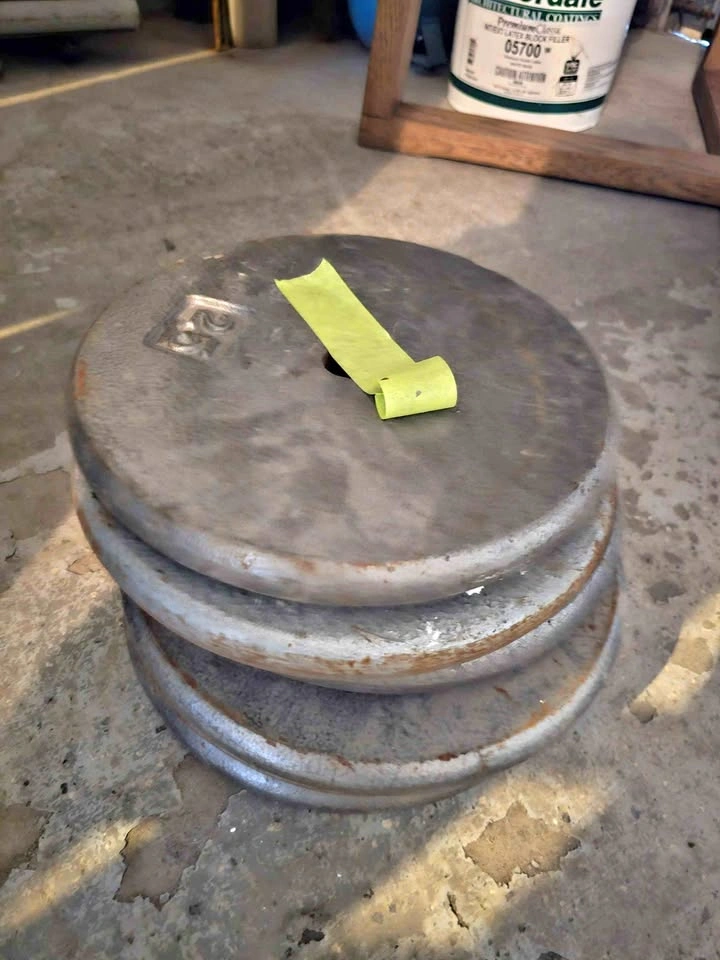 Four 25 lb Cast Iron Barbell Plates