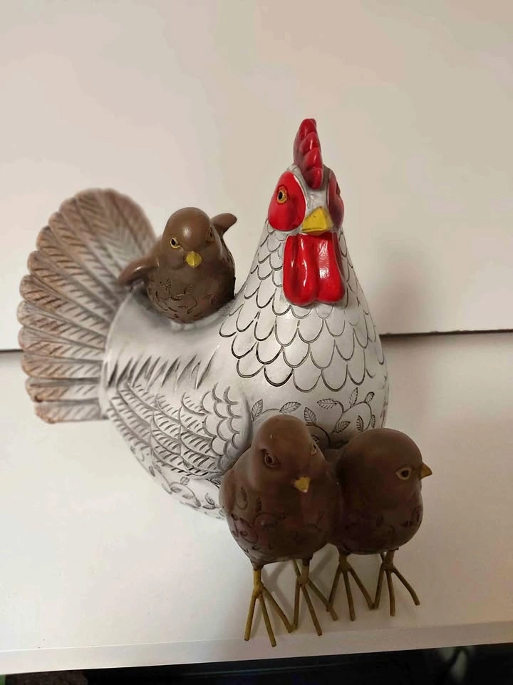 Ceramic hen with chick figurines
